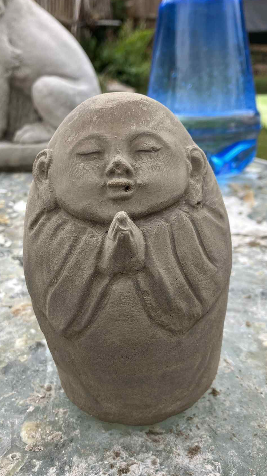 Stone concrete praying Buddha egg shaped garden decor